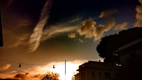 Low angle view of electricity pylon against sky