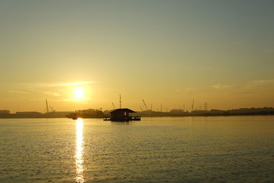 Scenic view of lake against sky during sunset