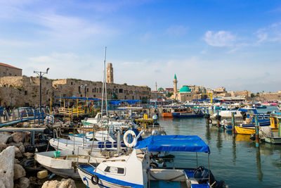 Boats moored at harbor