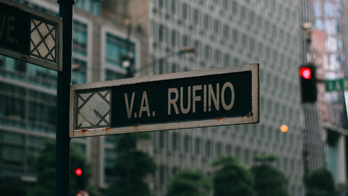 Close-up of information sign in v.a. rufino street makati