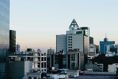 Modern cityscape against clear sky