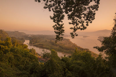 Scenic view of mountains against sky at sunset