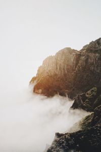 Scenic view of waterfall against clear sky