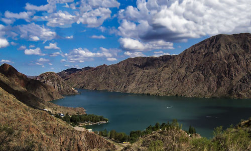 Scenic view of lake and mountains against sky