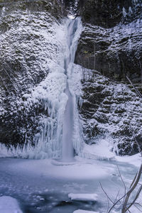 Scenic view of frozen waterfall during winter