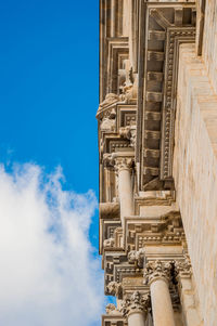 Low angle view of historical building against blue sky