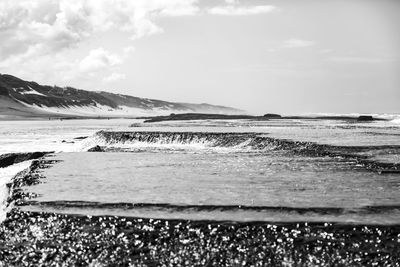 Scenic view of beach against sky