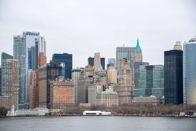 Buildings in city against sky