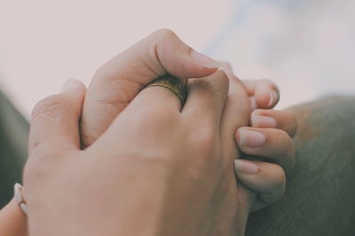 Close-up of couple holding hands