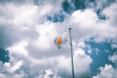 Low angle view of flag against sky