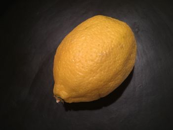 High angle view of yellow fruit on black background