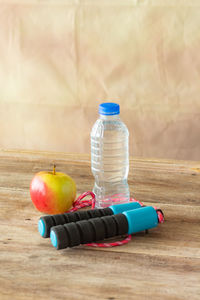 Close-up of fruits in bottle on table