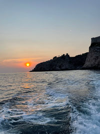 Scenic view of sea against sky during sunset