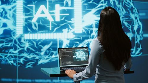 Midsection of woman using digital tablet