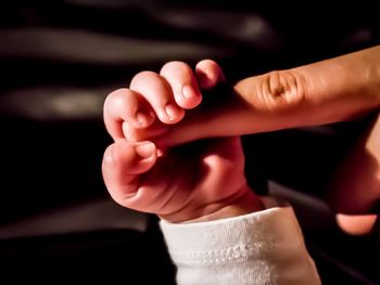 Close-up of hand holding hands