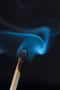 Close-up of match smoke against black background
