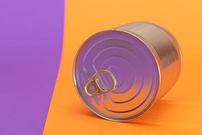 Directly above shot of container against yellow background