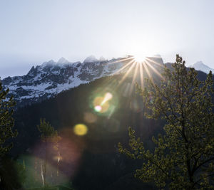 Scenic view of mountains against clear sky during winter