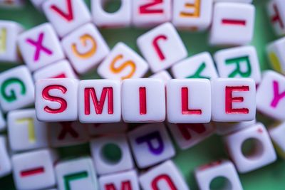 Smile word with red cube letters, feelings and emotions