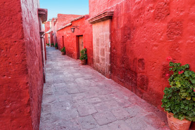 Alley amidst red houses at santa catalina monastery