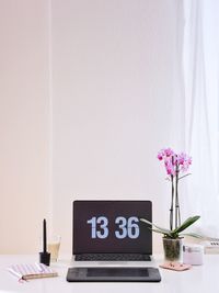 Close-up of flower vase on table at home