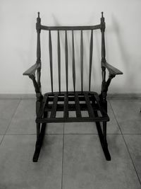 Empty bench on tiled floor