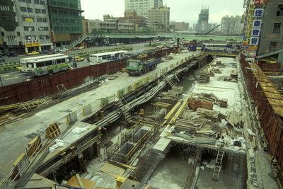 High angle view of railroad tracks amidst buildings in city