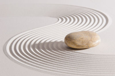 Close-up of stone on sand