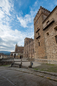 Old building against cloudy sky