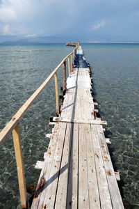 Pier over sea against sky