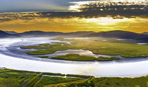 Scenic view of landscape against sky during sunset