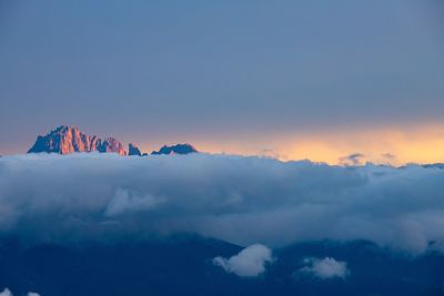 Low angle view of snowcapped mountains against sky during sunset