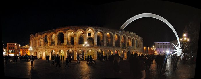 Group of people in illuminated building at night