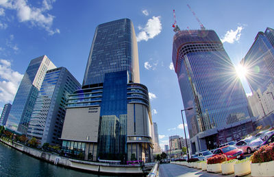 Skyscrapers against cloudy sky