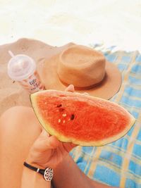 Cropped image of woman holding watermelon