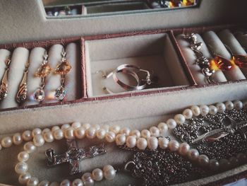 High angle view of jewelry in box