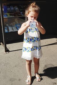 Full length of girl standing outdoors