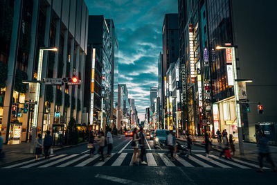 Panoramic view of city street against sky