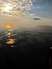 Close-up of landscape against sky during sunset