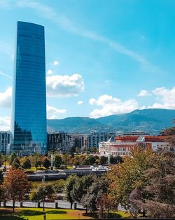 Modern buildings in city against sky