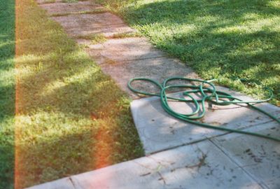 High angle view of bicycle on footpath