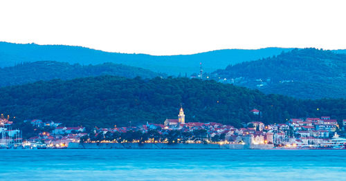 Scenic view of river and cityscape