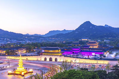 High angle view of illuminated buildings in city