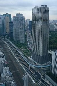 Cityscape against cloudy sky