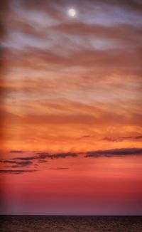 Scenic view of sea against dramatic sky