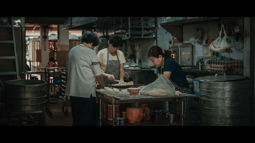 People working in kitchen