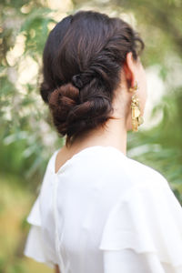 Side view of woman wearing earring