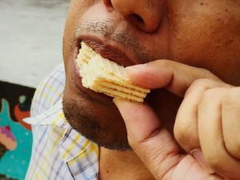 Close-up of man eating food