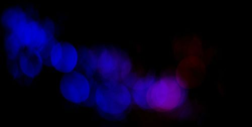 Defocused image of illuminated lights at night