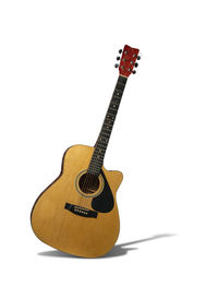 Close-up of guitar against white background